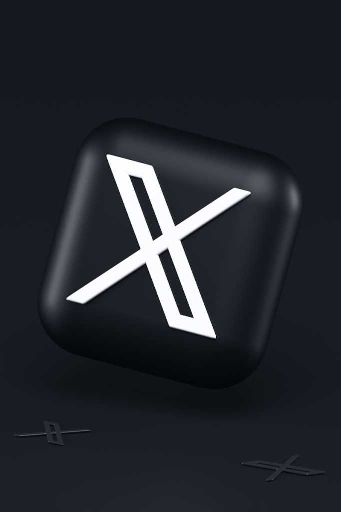 a black button with a white symbol on it