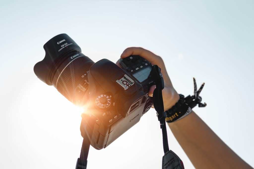 a person holding a camera up to take a picture